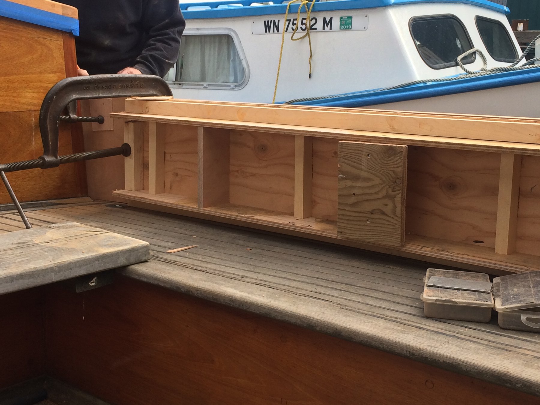 Fresh wooden cabinetry takes shape along the rail of Merry Maiden, revealing the meticulous craftsmanship required to restore this 1946 Philip Rhodes classic to her former glory in the Puget Sound.
